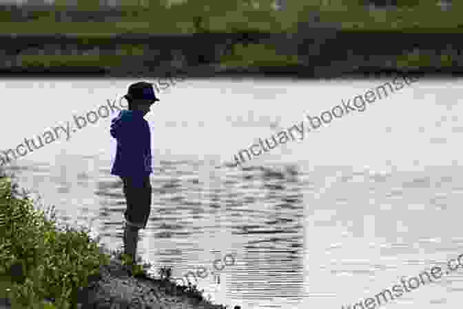 A Boy Stands On A Bridge, Looking Down At The Water. He Is Wearing A Red Hoodie And Jeans. His Face Is Obscured By The Shadow Of The Bridge, But His Body Language Suggests That He Is In Pain. Boy On The Bridge: The Story Of John Shalikashvili S American Success (American Warriors Series)