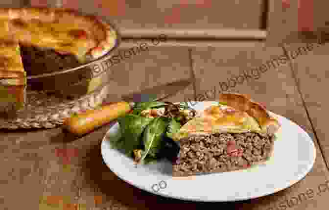 A Golden Brown Tourtiere, A Traditional Canadian Meat Pie With A Flaky Crust And Savory Filling CANADIAN RECIPES FOR YOU AND YOUR ENTIRE FAMILY
