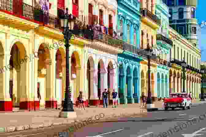 A Vibrant Street Scene In Old Havana, Cuba, With Colorful Buildings, Classic Cars, And Locals Dancing To Salsa Music. Galavanting Goddess: Alaska To Cuba And Back